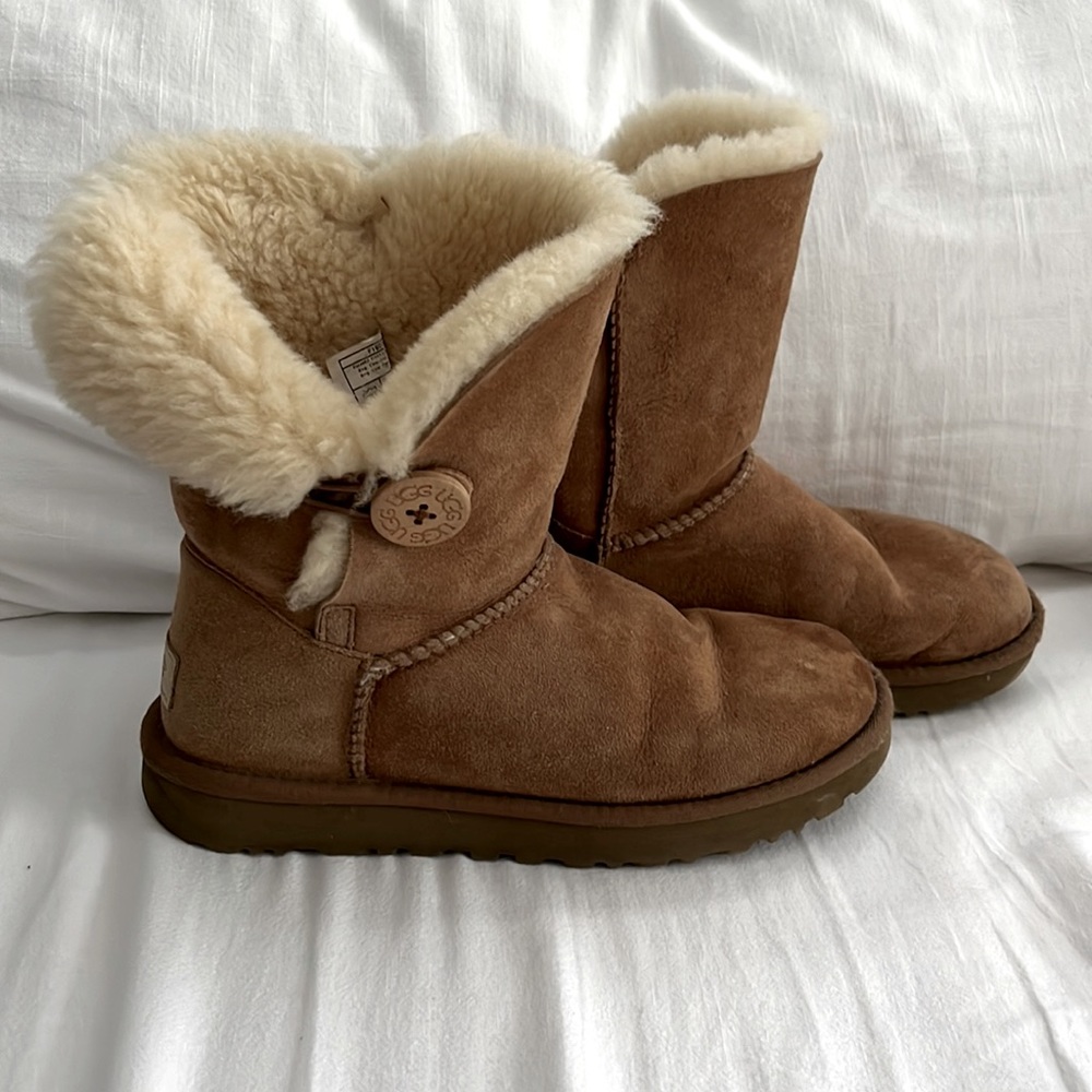 Ugh booties with button closure.  Brown color size 7